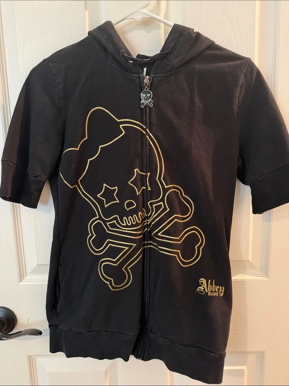 Abbey Dawn Black Short-Sleeve Zip Hoodie with Gold Skull Graphic - Picture 1 of 10